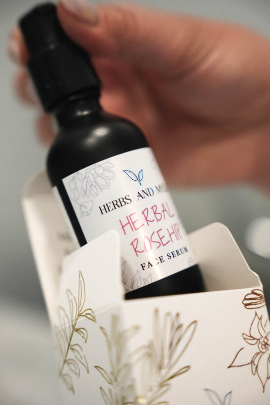 Herbal Rose Hip face serum close-up on skin