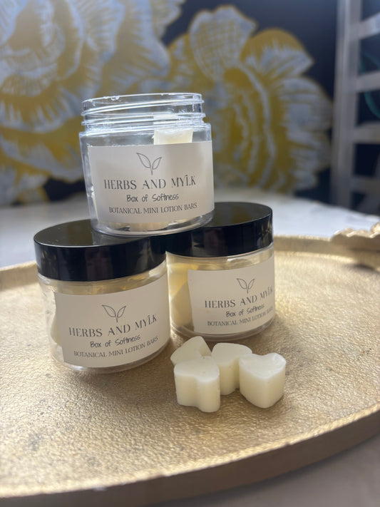 Box of Softness lotion bar close-up in hand